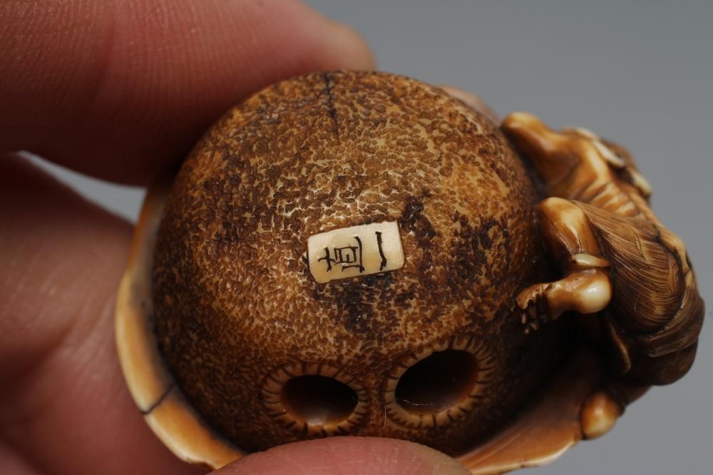 A JAPANESE IVORY NETSUKE Image