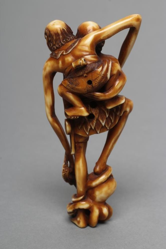 A JAPANESE STAINED IVORY NETSUKE Image