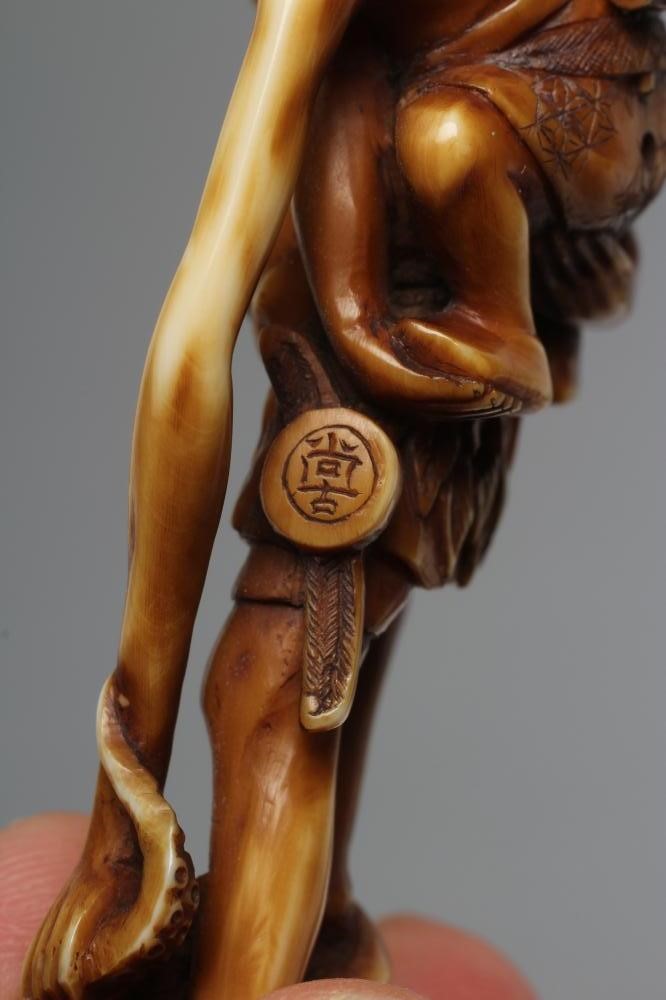 A JAPANESE STAINED IVORY NETSUKE Image