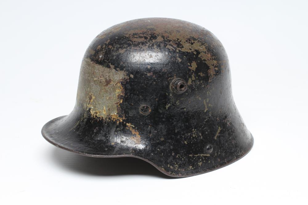 A FIRST WORLD WAR GERMAN M16 HELMET of typical form with painted exterior Image