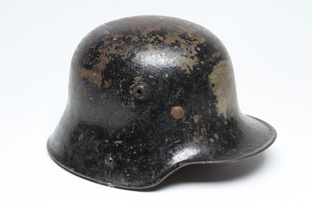 A FIRST WORLD WAR GERMAN M16 HELMET of typical form with painted exterior Image