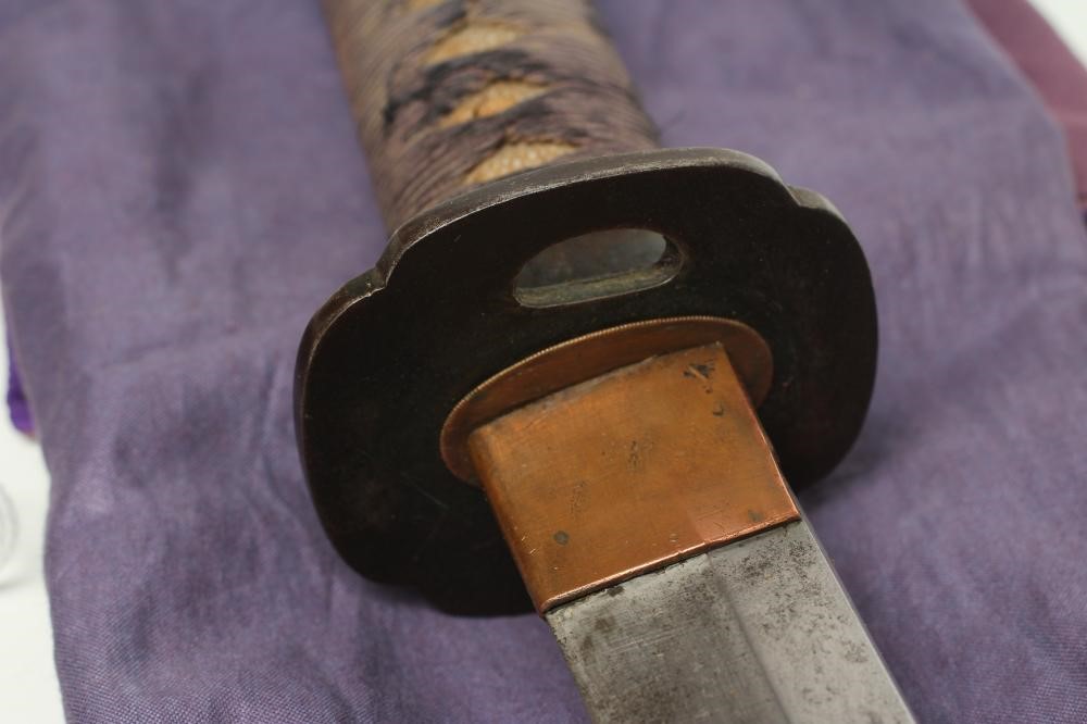 A JAPANESE OFFICER'S KATANA with 25 1/2" curved blade Image
