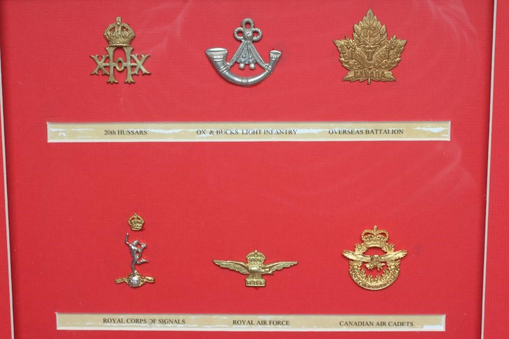 FIVE FRAMED DISPLAYS OF BRITISH MILITARY CAP BADGES Image