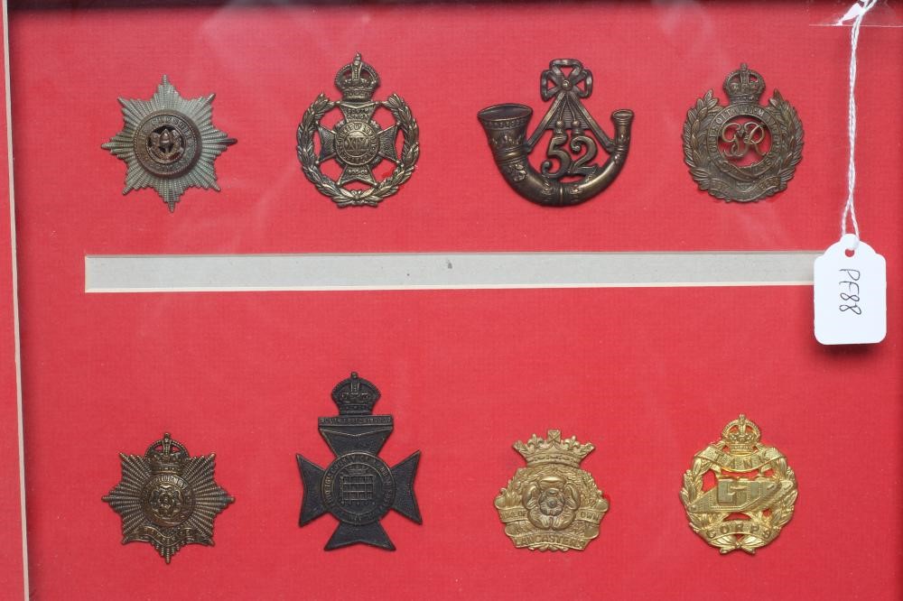 FIVE FRAMED DISPLAYS OF BRITISH MILITARY CAP BADGES Image