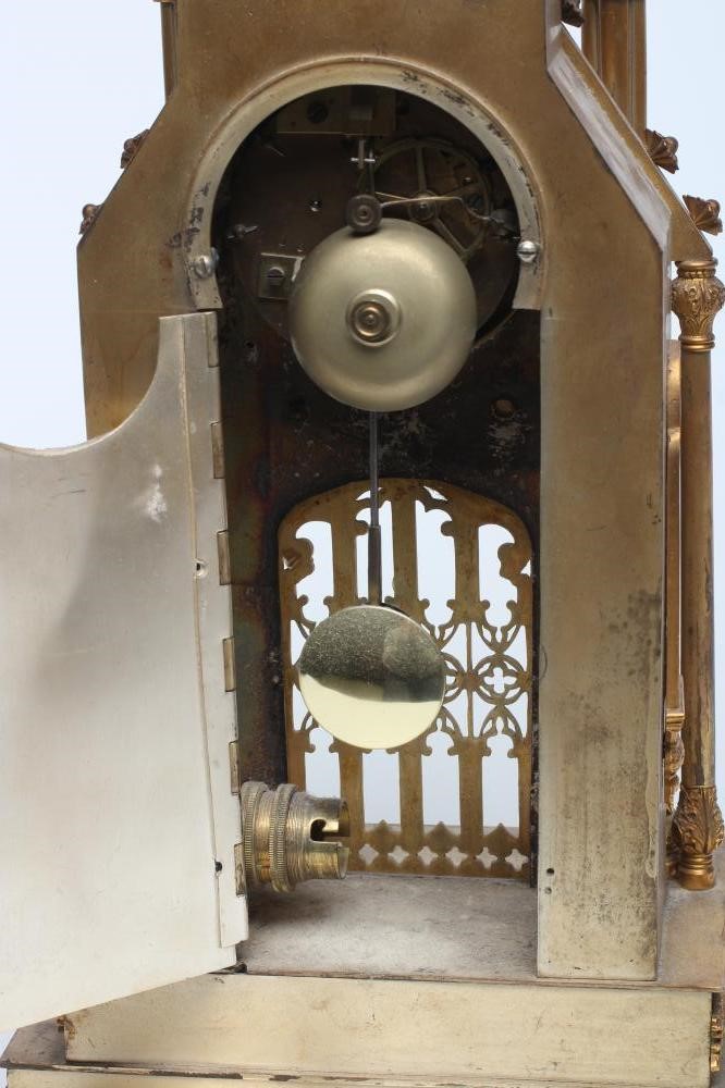 A FRENCH GILT METAL CATHEDRAL CLOCK Image