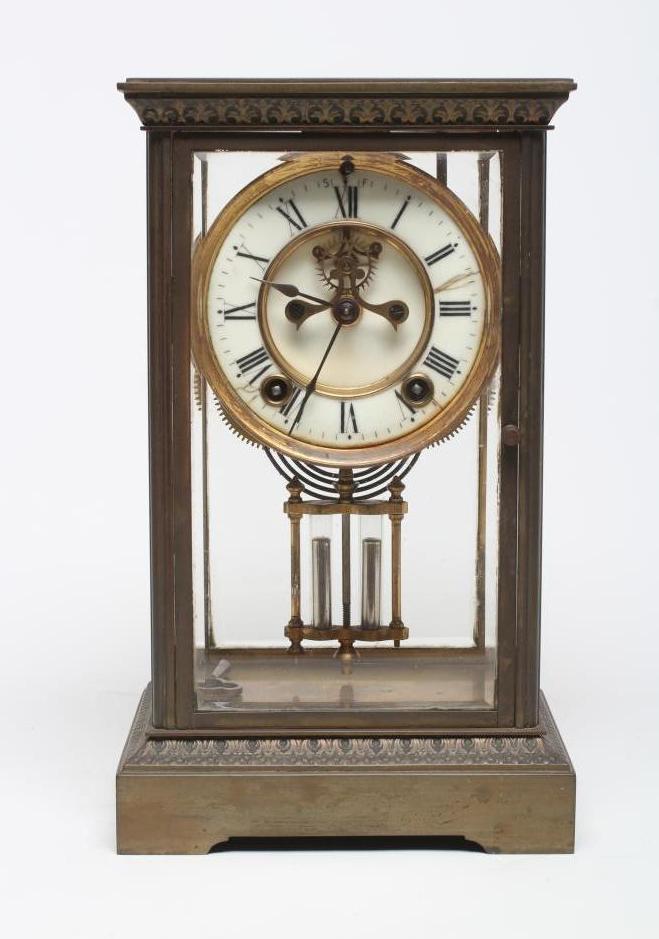 A BRASS FOUR GLASS MANTEL CLOCK Image