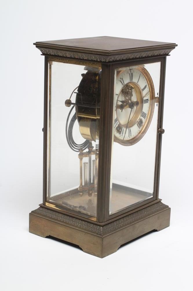 A BRASS FOUR GLASS MANTEL CLOCK Image