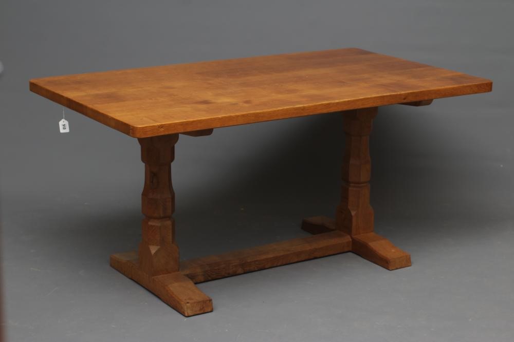 A ROBERT THOMPSON ADZED OAK DINING TABLE Image