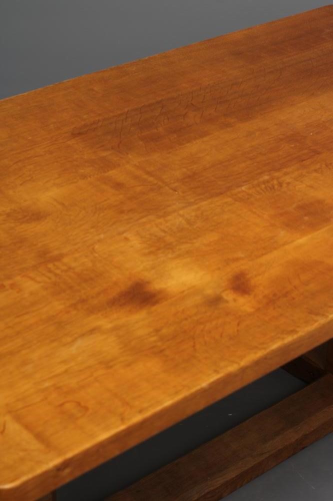 A ROBERT THOMPSON ADZED OAK DINING TABLE Image