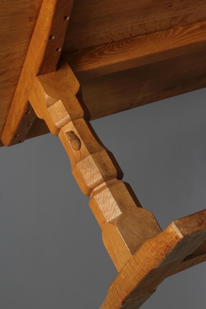 A ROBERT THOMPSON ADZED OAK DINING TABLE Image