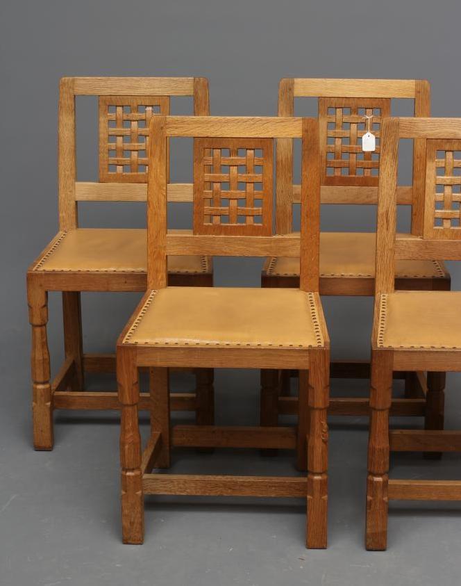 A ROBERT THOMPSON SET OF FOUR OAK DINING CHAIRS Image