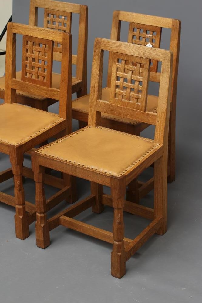 A ROBERT THOMPSON SET OF FOUR OAK DINING CHAIRS Image
