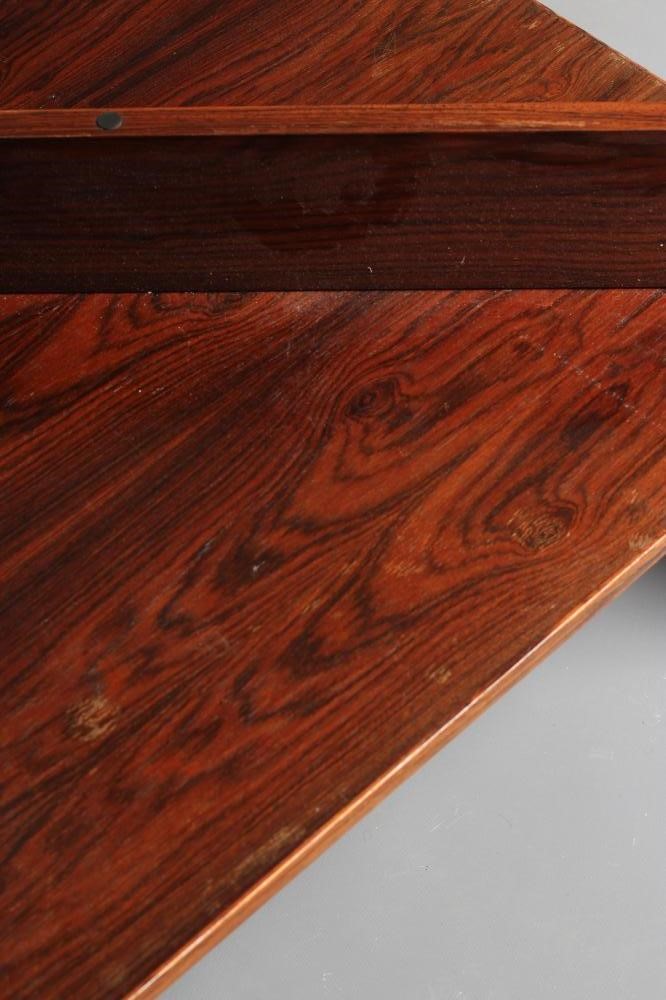 A ROSEWOOD VENEERED COFFEE TABLE Image