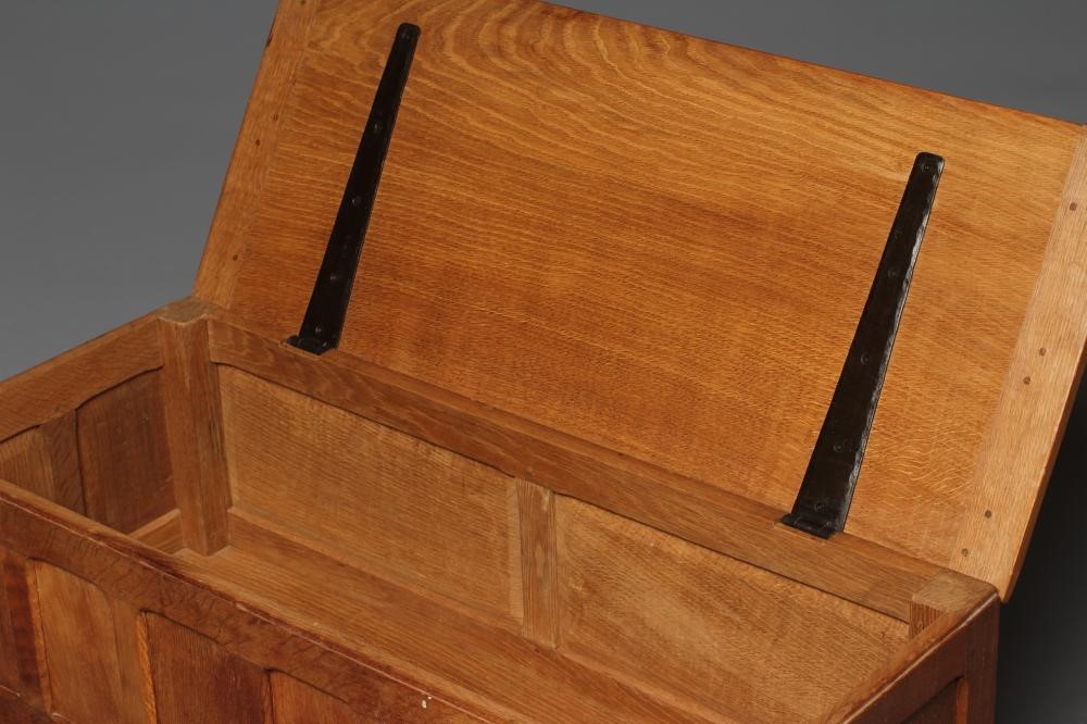 A WILF HUTCHINSON ADZED OAK BLANKET BOX of canted oblong form with cleated hinged lid Image