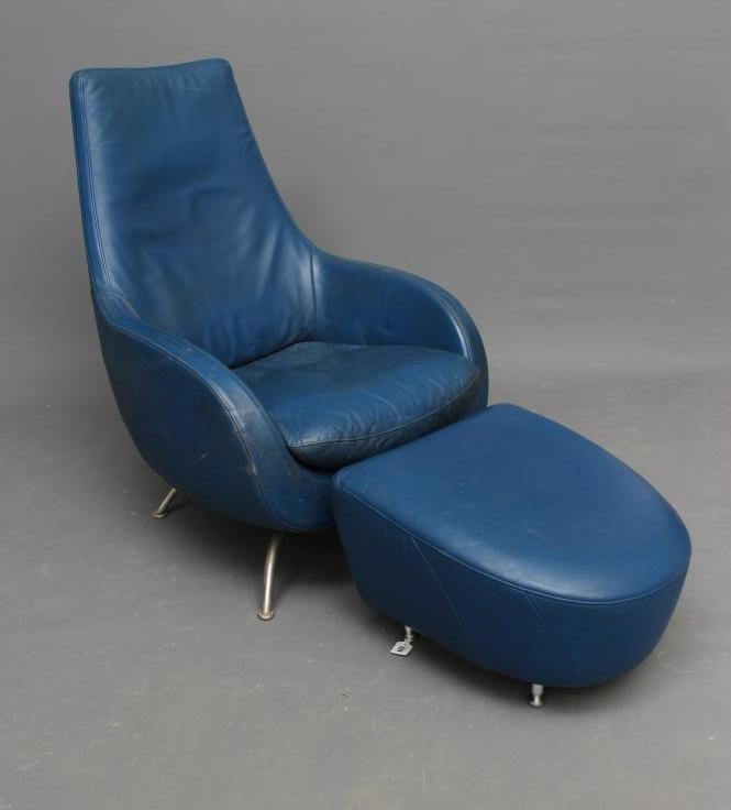 A ROLF BENZ BLUE LEATHER SWIVEL ARMCHAIR Image