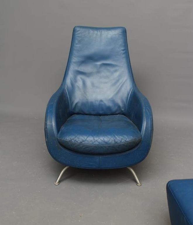 A ROLF BENZ BLUE LEATHER SWIVEL ARMCHAIR Image