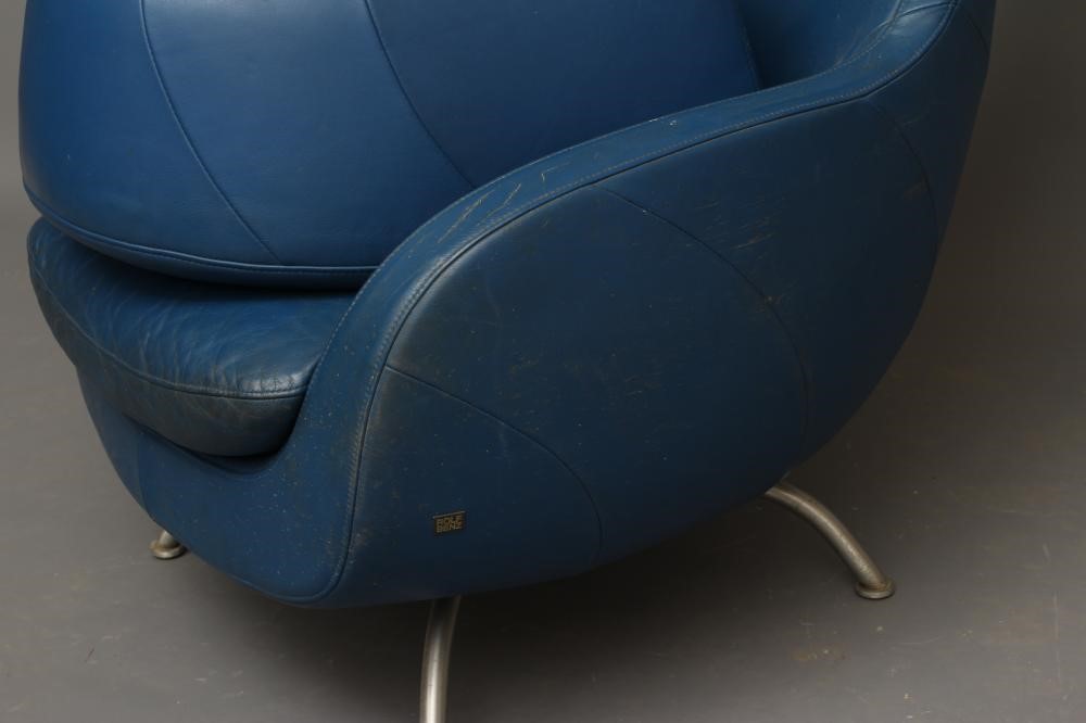 A ROLF BENZ BLUE LEATHER SWIVEL ARMCHAIR Image