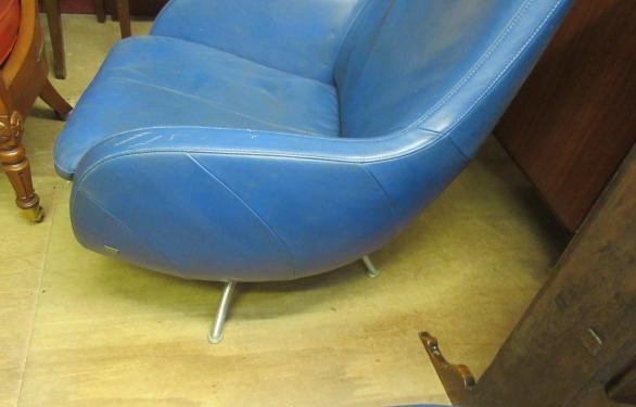 A ROLF BENZ BLUE LEATHER SWIVEL ARMCHAIR Image