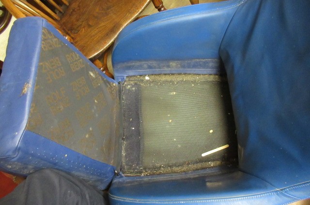 A ROLF BENZ BLUE LEATHER SWIVEL ARMCHAIR Image