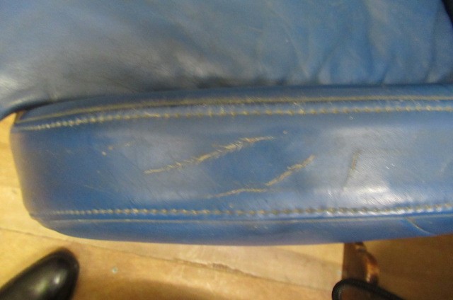 A ROLF BENZ BLUE LEATHER SWIVEL ARMCHAIR Image