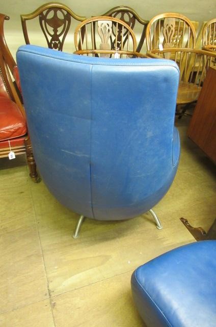 A ROLF BENZ BLUE LEATHER SWIVEL ARMCHAIR Image