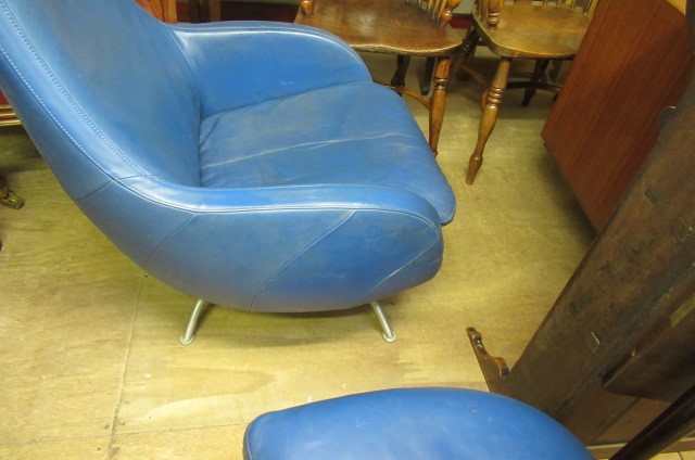 A ROLF BENZ BLUE LEATHER SWIVEL ARMCHAIR Image