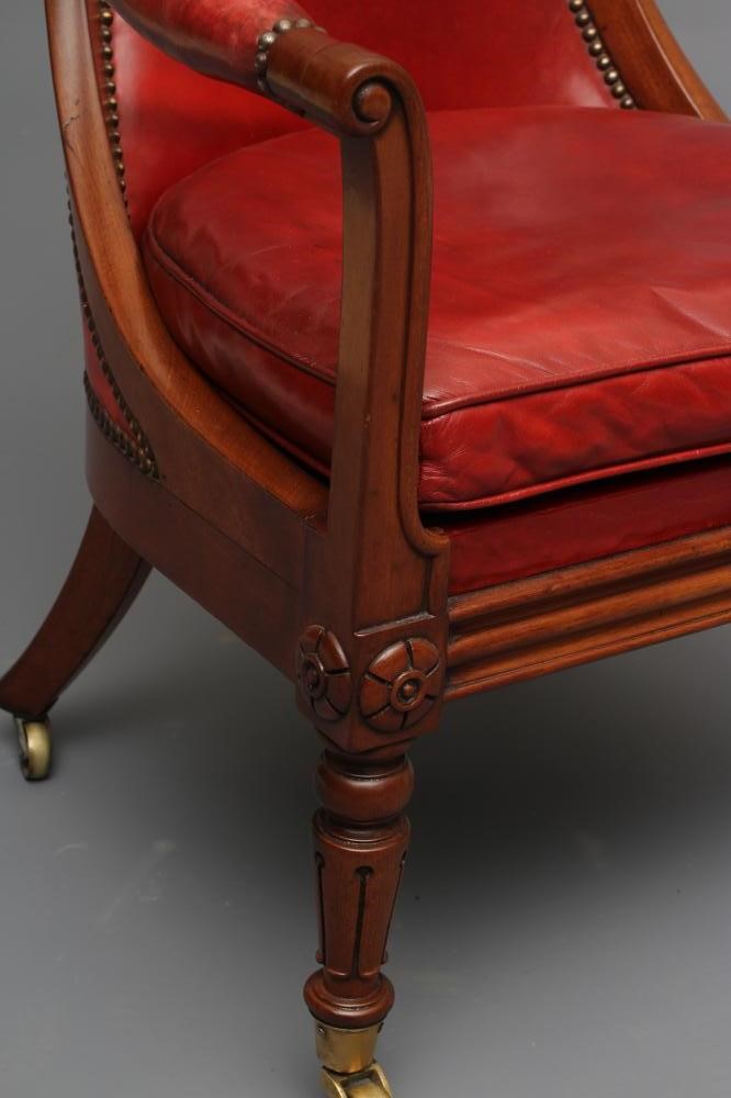 A WILLIAM IV MAHOGANY FRAMED BERGERE upholstered in red leather Image