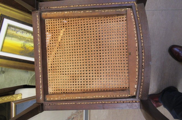 AN EDWARDIAN MAHOGANY AND CANED BERGERE with stringing Image