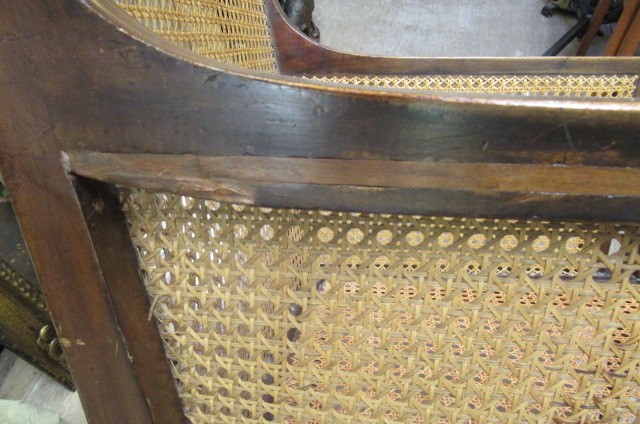 AN EDWARDIAN MAHOGANY AND CANED BERGERE with stringing Image