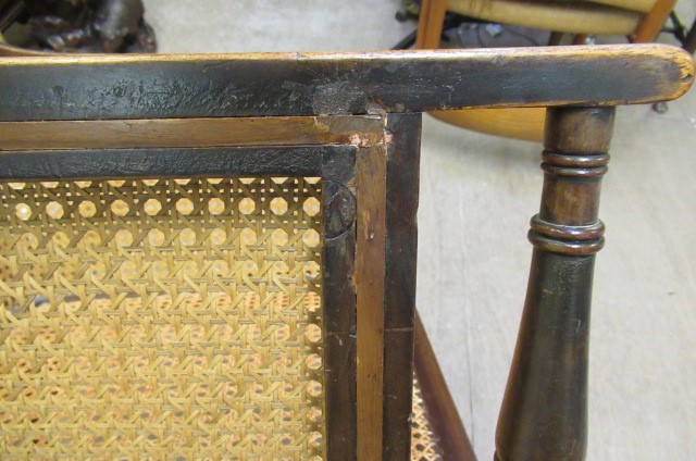 AN EDWARDIAN MAHOGANY AND CANED BERGERE with stringing Image