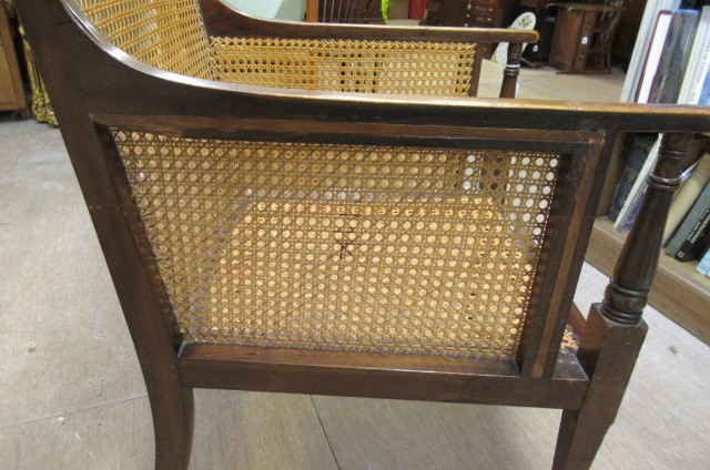 AN EDWARDIAN MAHOGANY AND CANED BERGERE with stringing Image