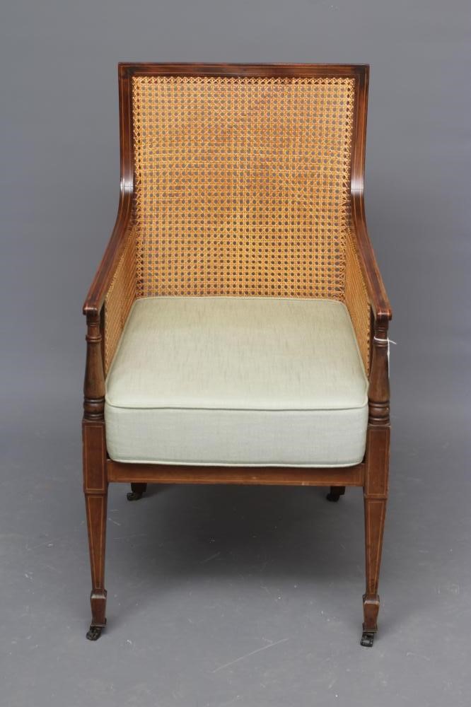 AN EDWARDIAN MAHOGANY AND CANED BERGERE with stringing Image