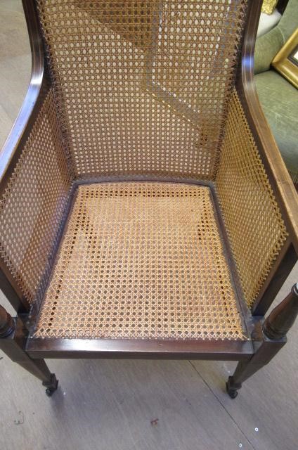 AN EDWARDIAN MAHOGANY AND CANED BERGERE with stringing Image