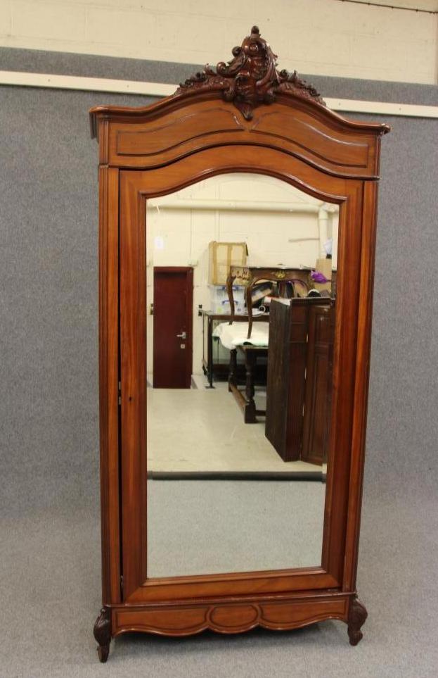 A MAHOGANY ARMOIRE Image