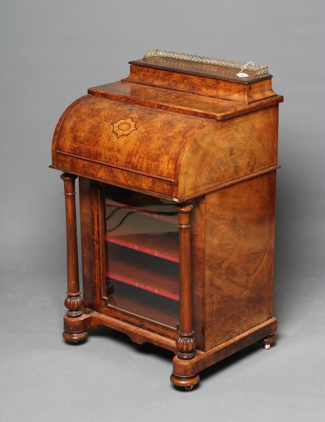 AN EARLY VICTORIAN FIGURED WALNUT DAVENPORT Image
