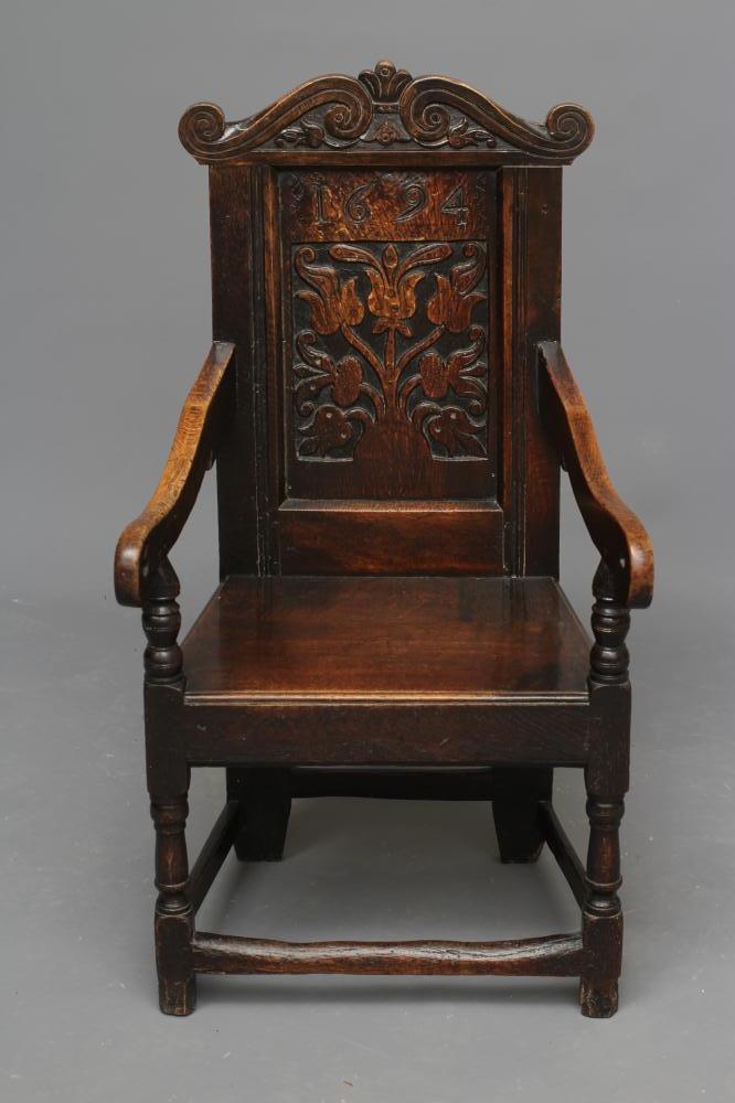 A JOINED OAK ARMCHAIR Image