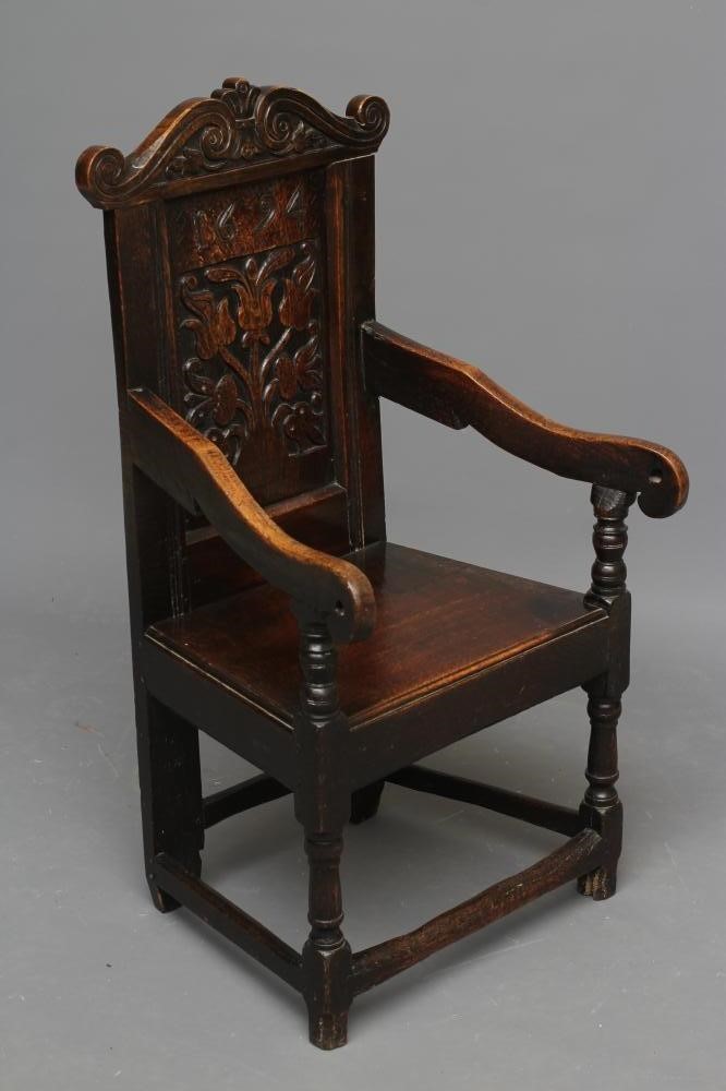 A JOINED OAK ARMCHAIR Image