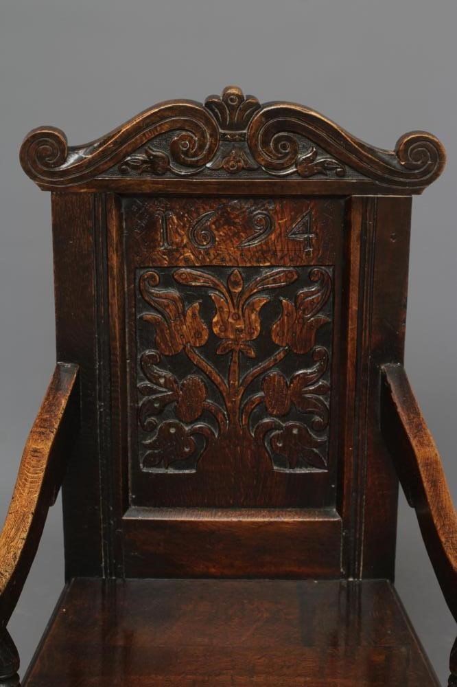 A JOINED OAK ARMCHAIR Image
