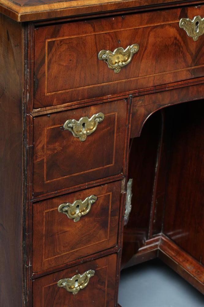 A GEORGE I AND LATER WALNUT KNEEHOLE DESK Image