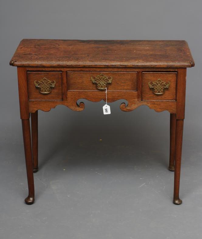 A GEORGE III OAK LOW BOY Image
