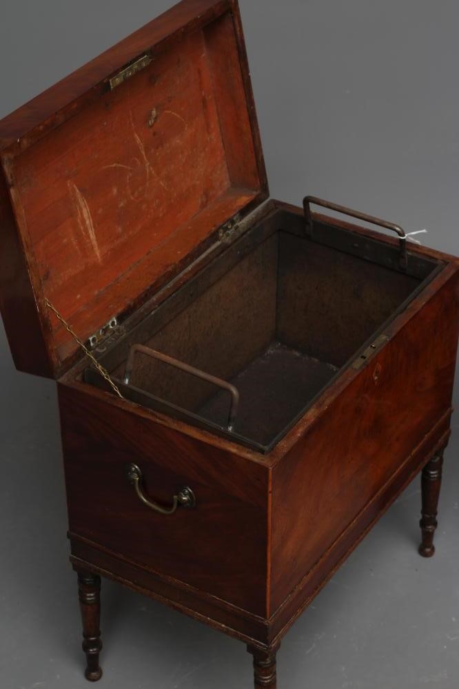 A LATE GEORGIAN MAHOGANY CELLARETTE of oblong form with brass carrying handles Image