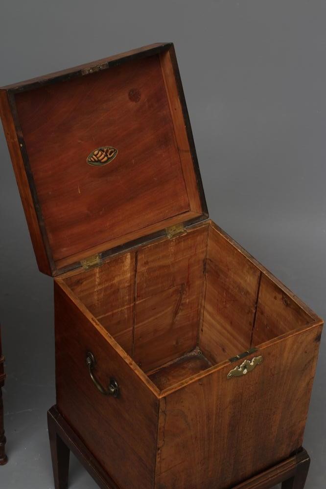 A LATE GEORGIAN MAHOGANY CELLARETTE of oblong form with brass carrying handles Image
