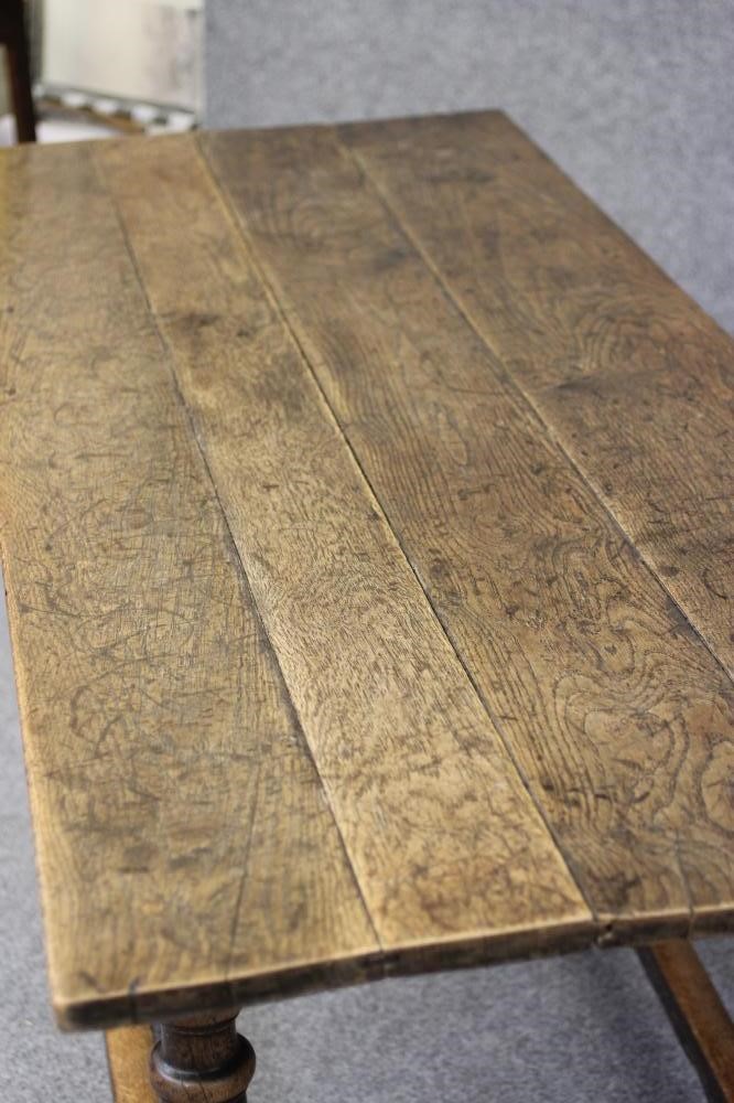 A JOINED OAK DINING TABLE Image