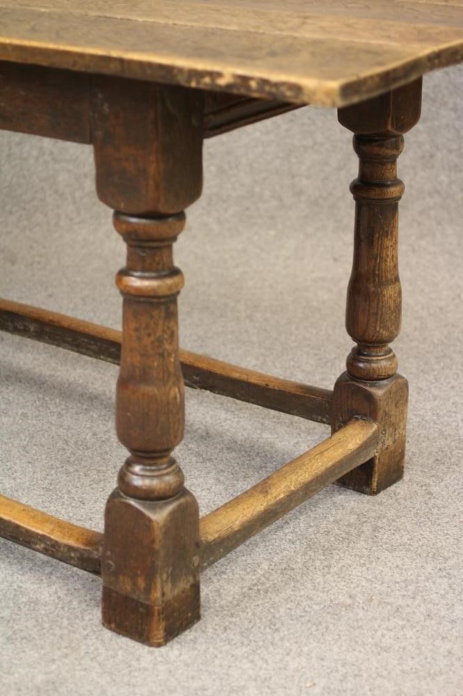 A JOINED OAK DINING TABLE Image