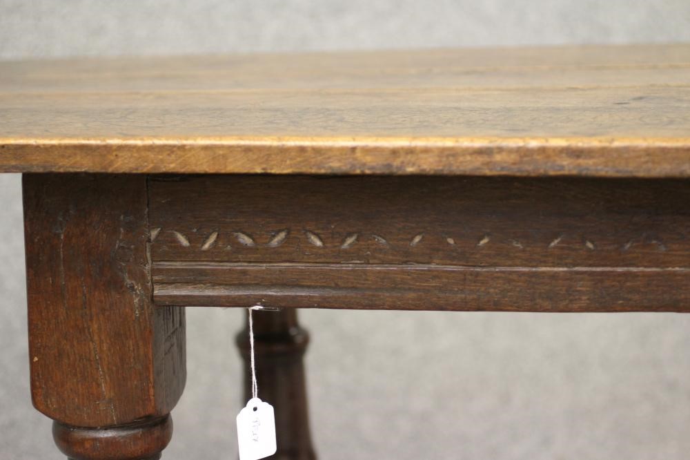 A JOINED OAK DINING TABLE Image