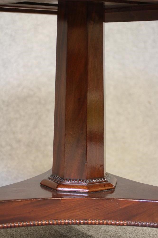 AN EARLY VICTORIAN MAHOGANY BREAKFAST TABLE Image