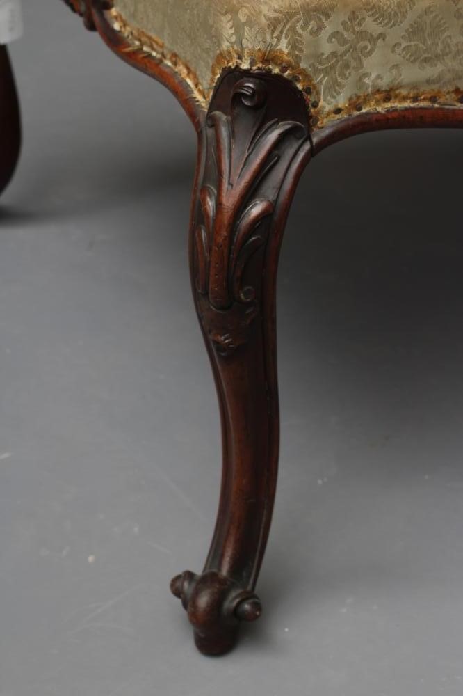 A VICTORIAN CARVED MAHOGANY DRESSING STOOL of oblong form upholstered in pale green silk damask Image