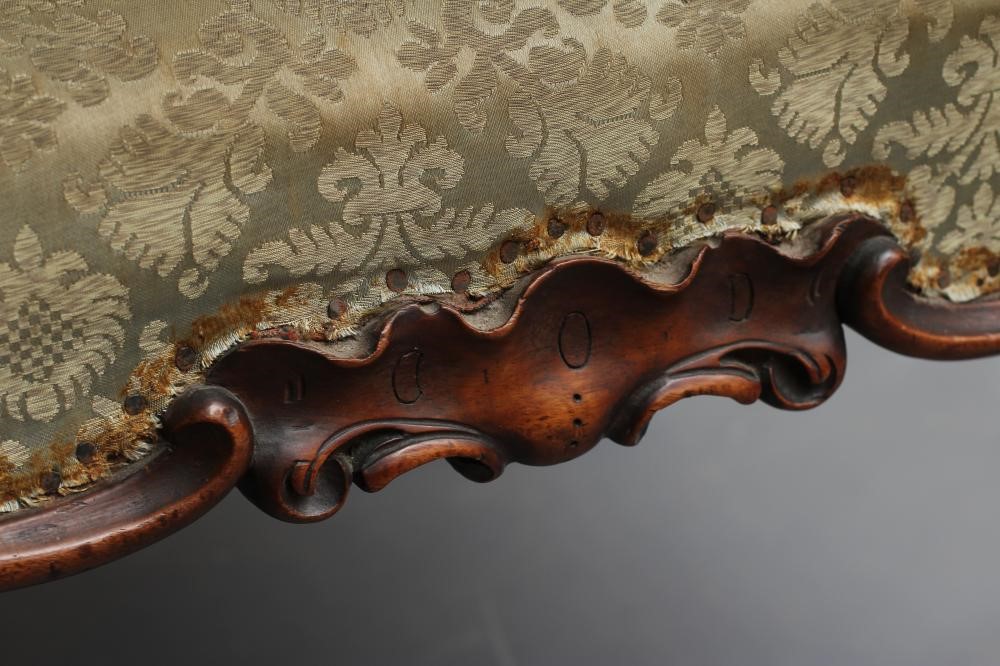 A VICTORIAN CARVED MAHOGANY DRESSING STOOL of oblong form upholstered in pale green silk damask Image