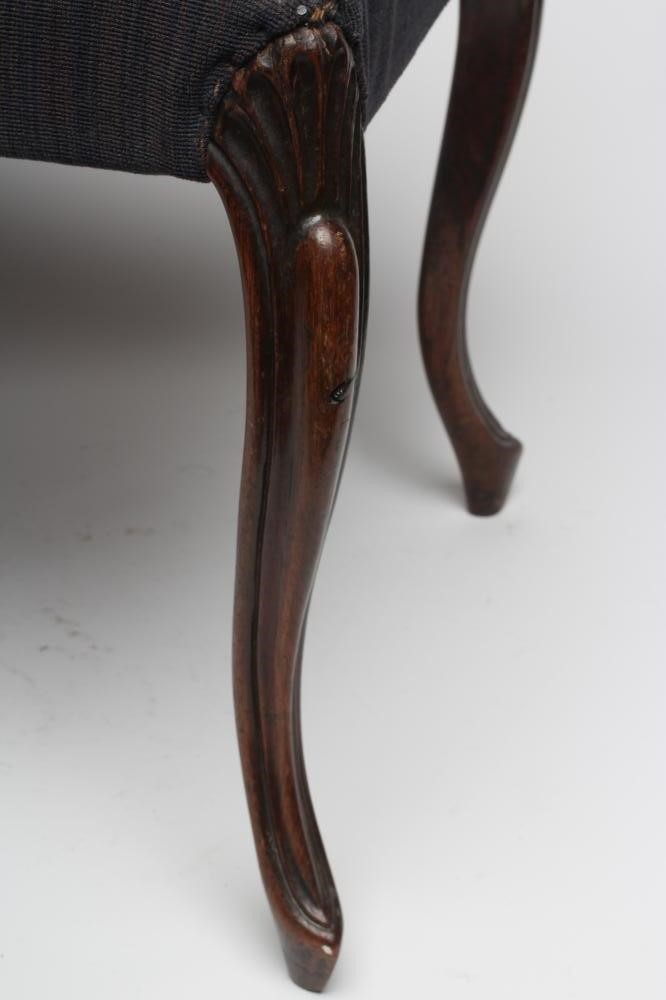 A VICTORIAN ROSEWOOD CARVED DRESSING STOOL of oblong form upholstered with a floral blue ground Image