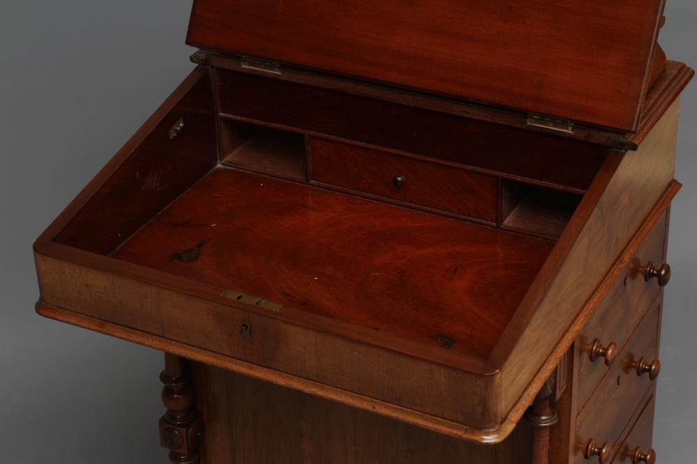 A VICTORIAN WALNUT DAVENPORT Image